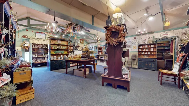 a room filled with furniture and a book shelf