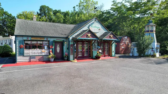 an aerial view of house with yard