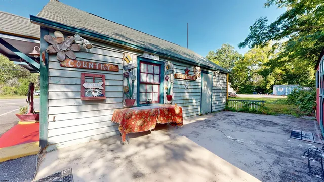 a living room with fireplace furniture and a fireplace