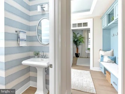 a en suite bathroom with a sink and mirror