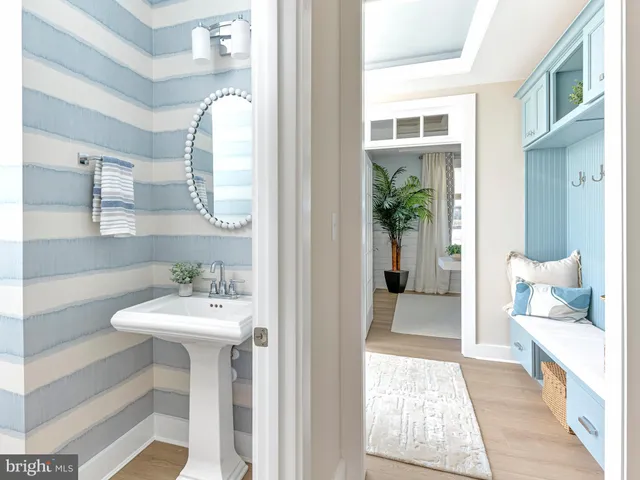 a en suite bathroom with a sink and mirror