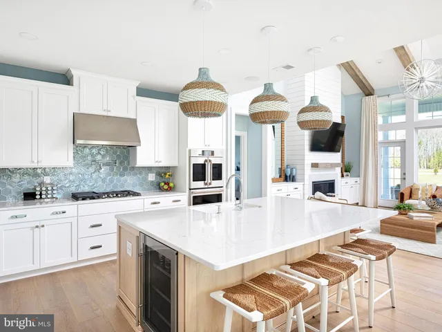a large kitchen with cabinets a sink and a stove