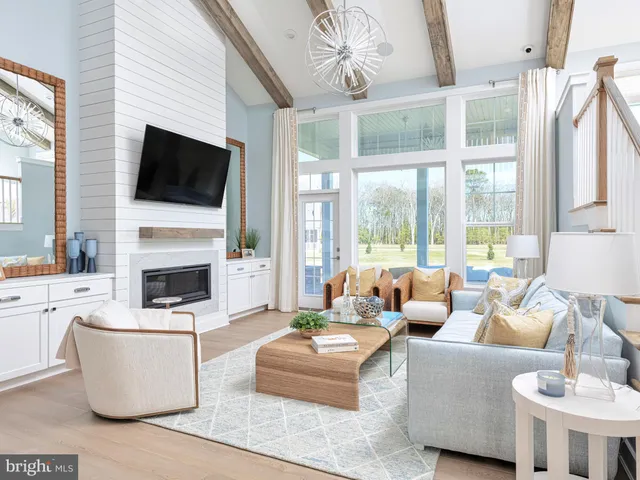 a living room with fireplace furniture and a flat screen tv
