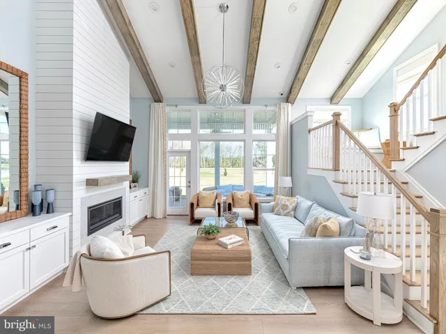 a living room with furniture fireplace and flat screen tv