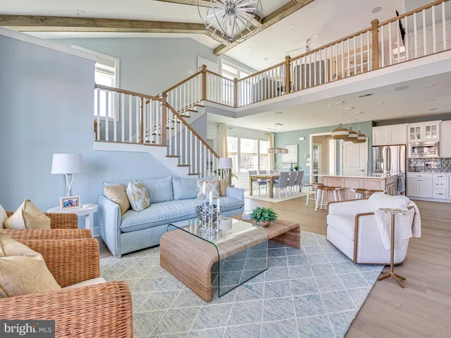 a living room with fireplace furniture and a rug