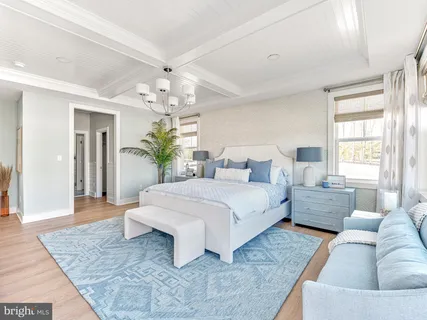 a spacious bedroom with a large bed and a couch