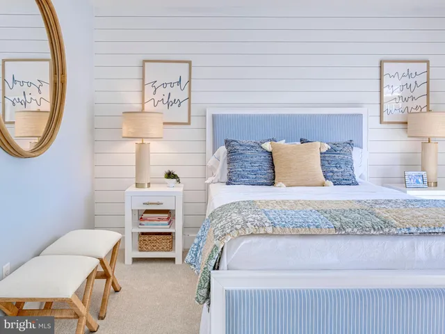 a bedroom with a bed and a chair