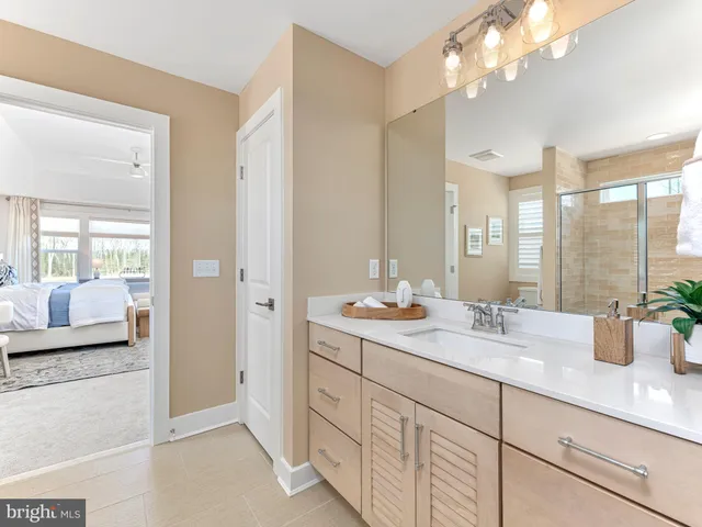 a bathroom that has a glass shower door