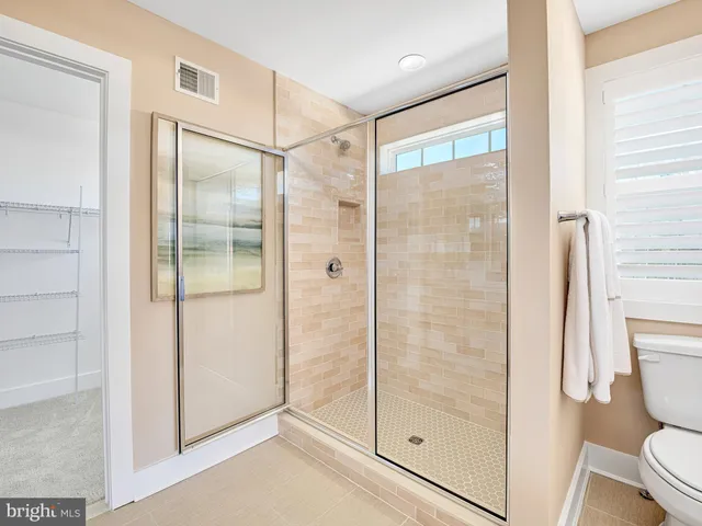 a view of a patio with a table chairs and a fire pit