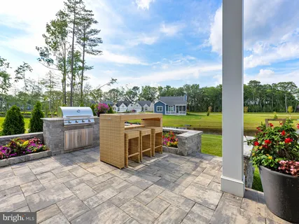 a view of a living room with furniture and a potted plant