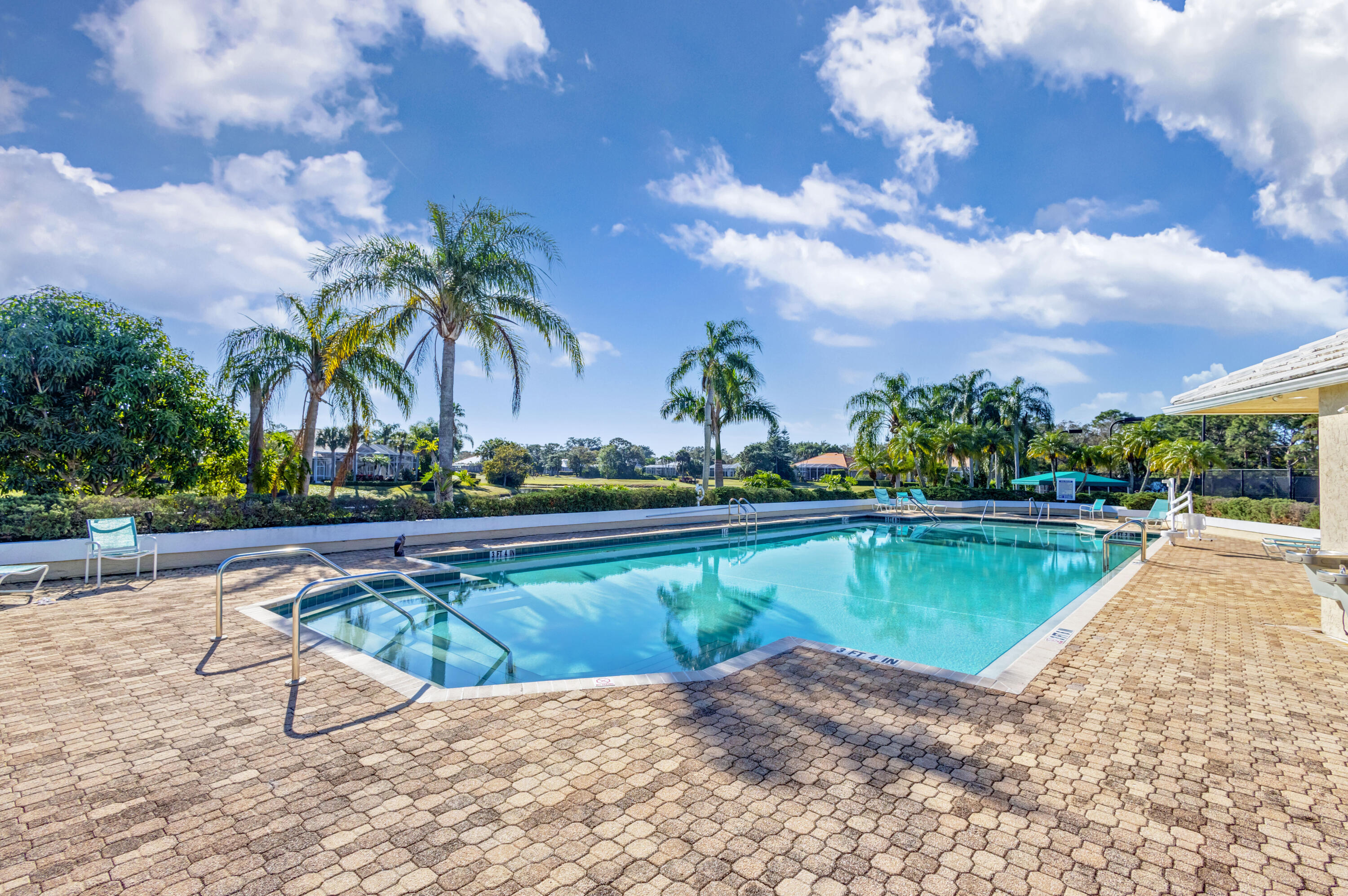 2199 Southwest Brookhaven Way Palm City, FL 34990 - Photo 105 of 119 a view of swimming pool with outdoor seating and plants