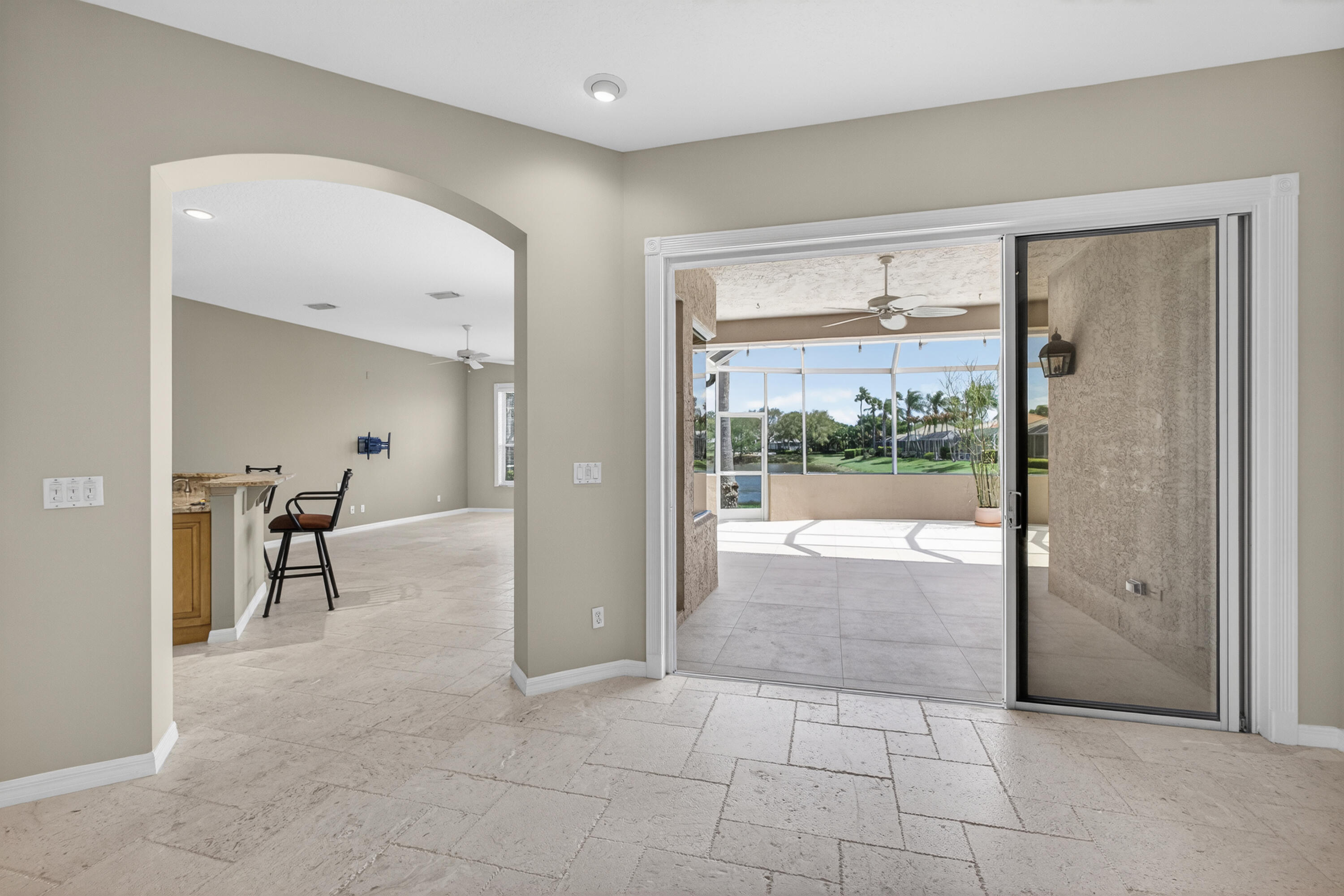 2199 Southwest Brookhaven Way Palm City, FL 34990 - Photo 13 of 119 a view of livingroom with furniture and floor to ceiling window