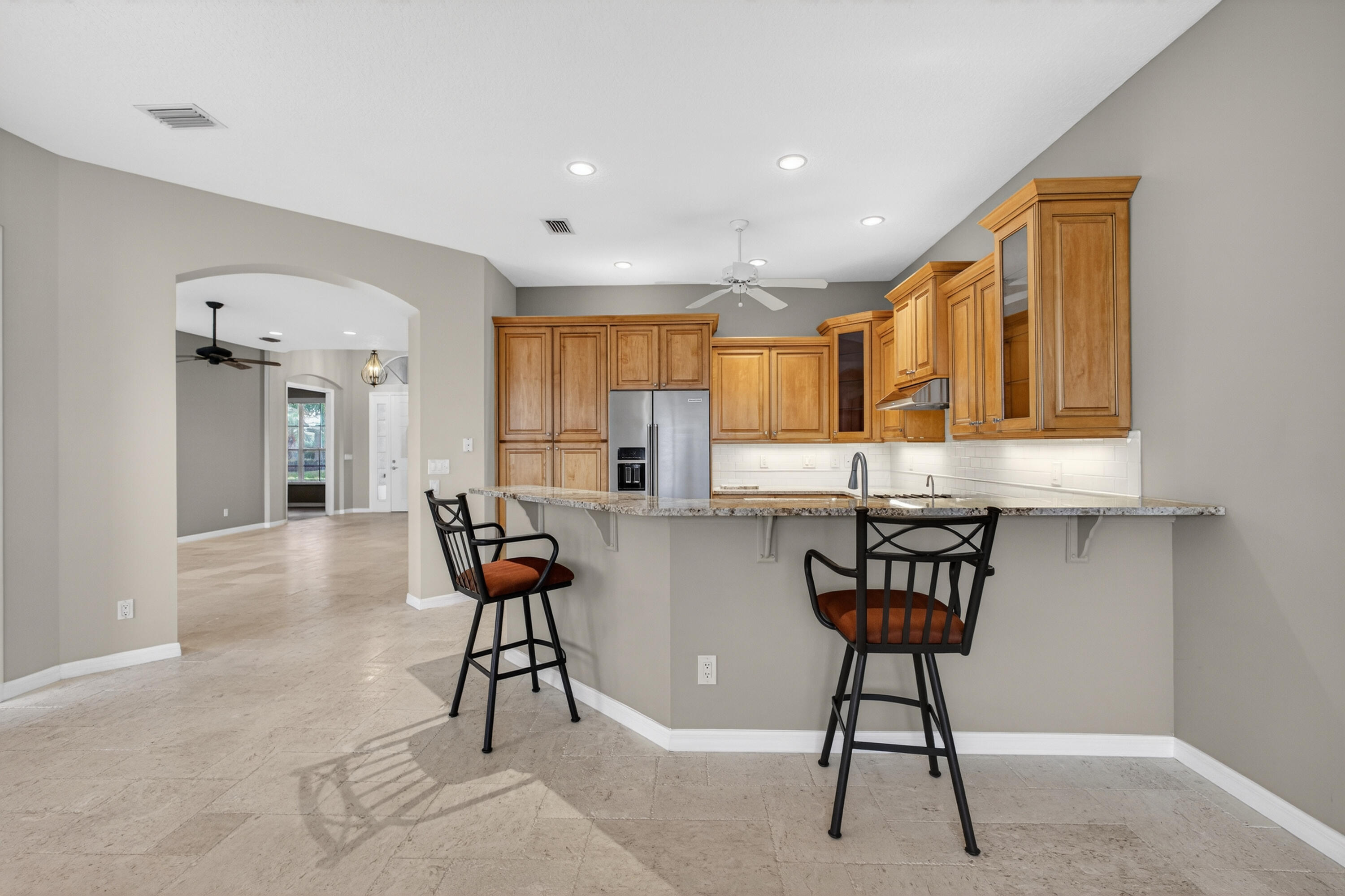 2199 Southwest Brookhaven Way Palm City, FL 34990 - Photo 22 of 119 a view of a kitchen and dining room