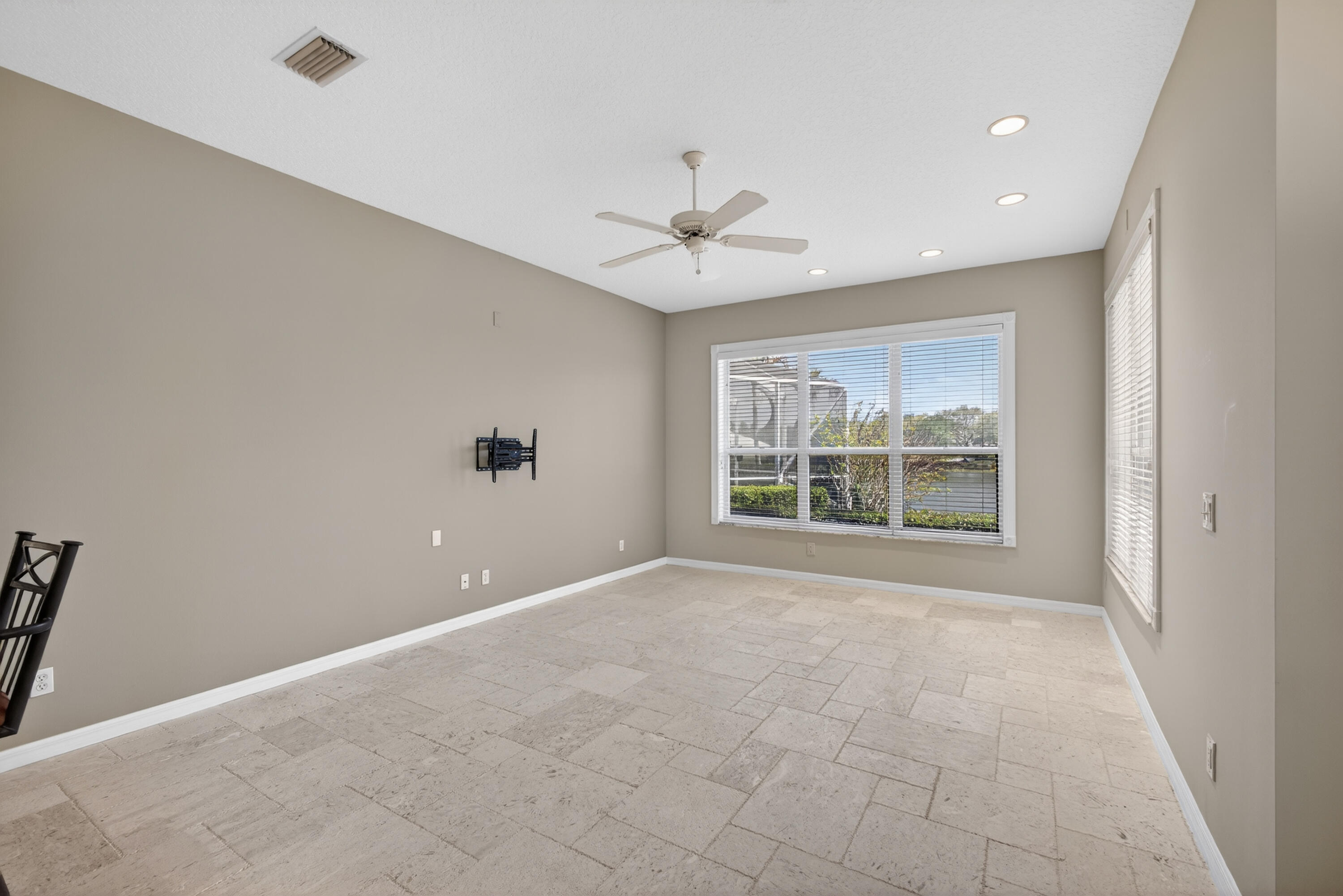 2199 Southwest Brookhaven Way Palm City, FL 34990 - Photo 33 of 119 a view of an empty room with a window