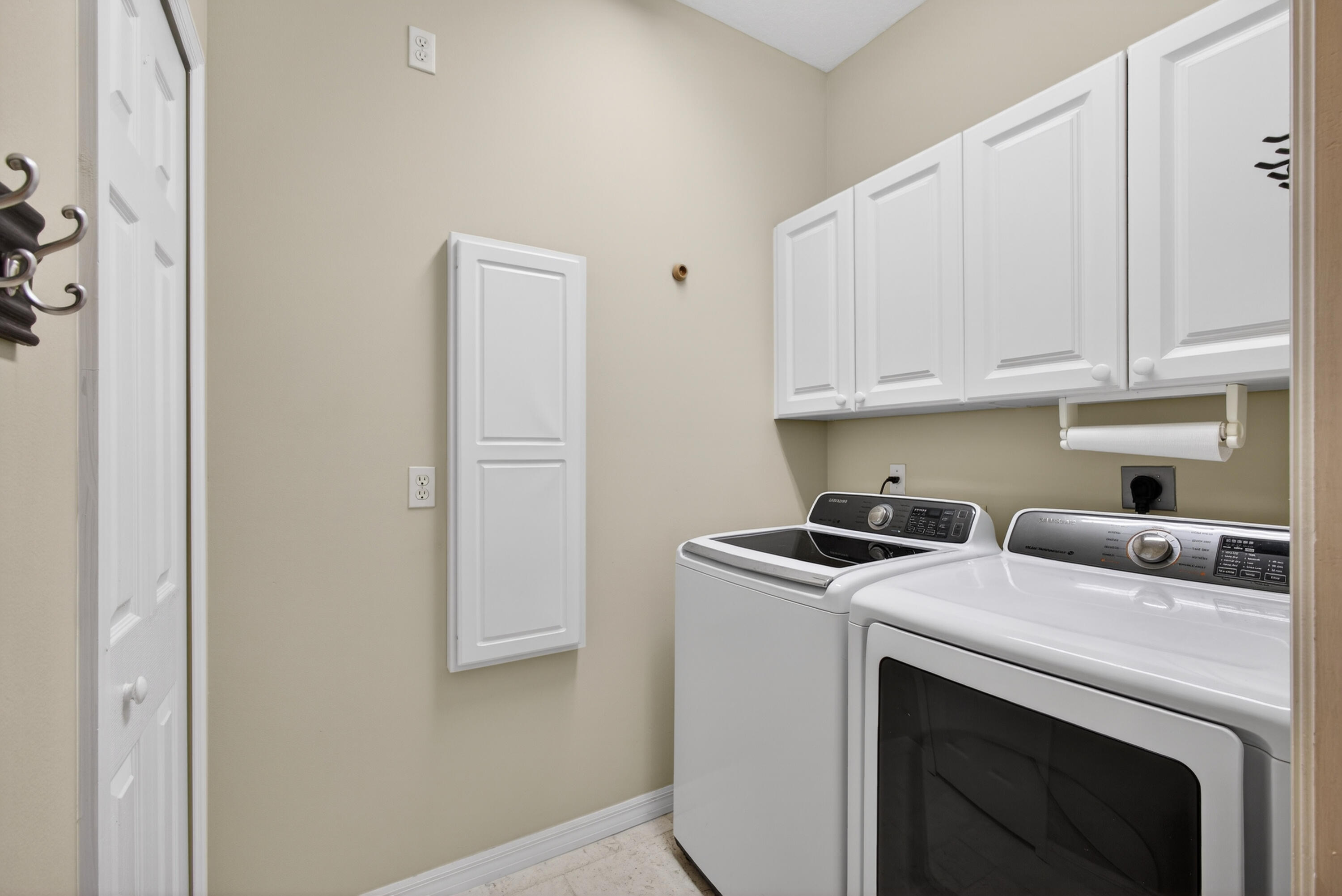 2199 Southwest Brookhaven Way Palm City, FL 34990 - Photo 59 of 119 a view of washer and dryer with kitchen countertops