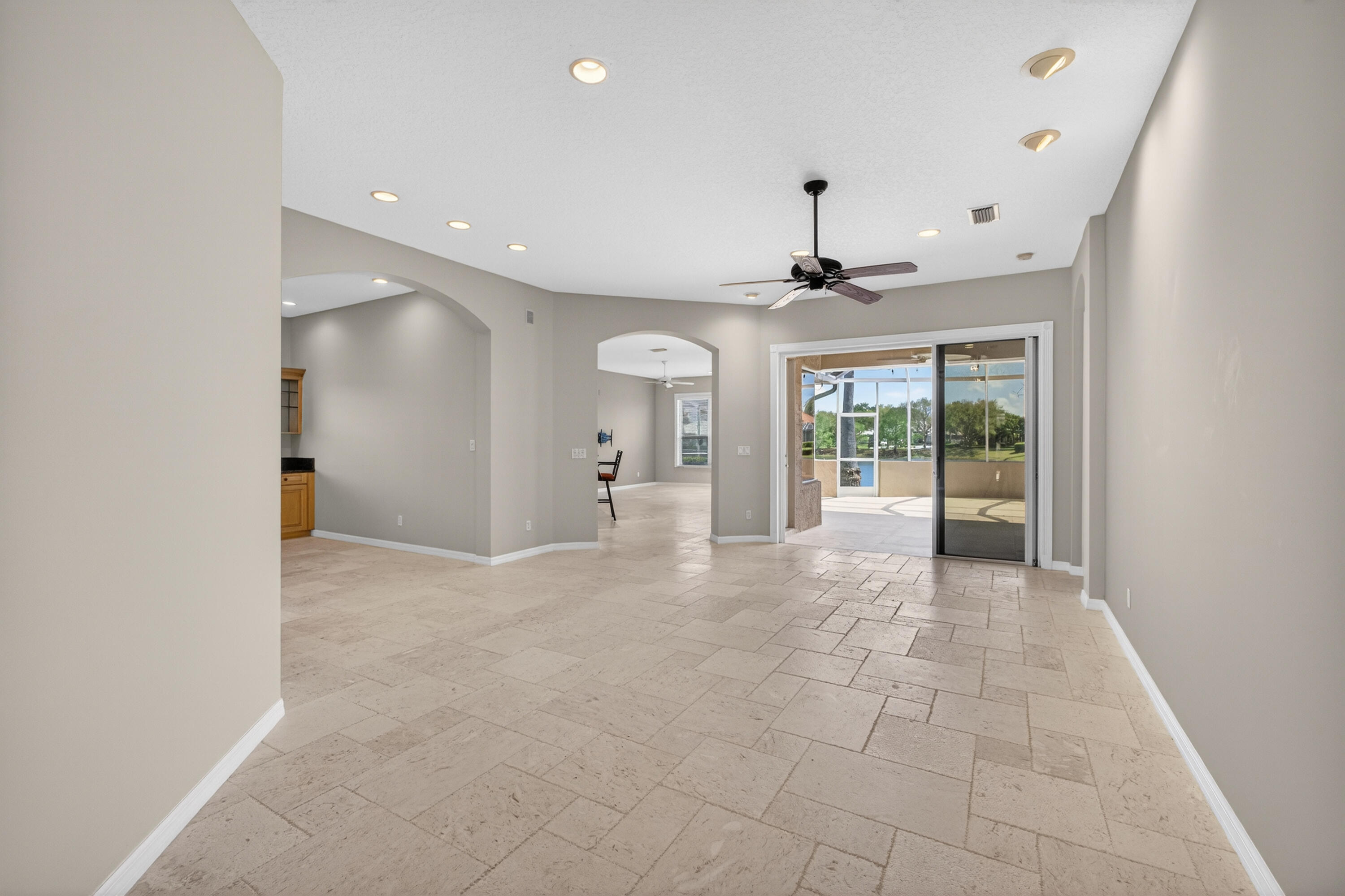 2199 Southwest Brookhaven Way Palm City, FL 34990 - Photo 6 of 119 a view of an empty room with a chandelier