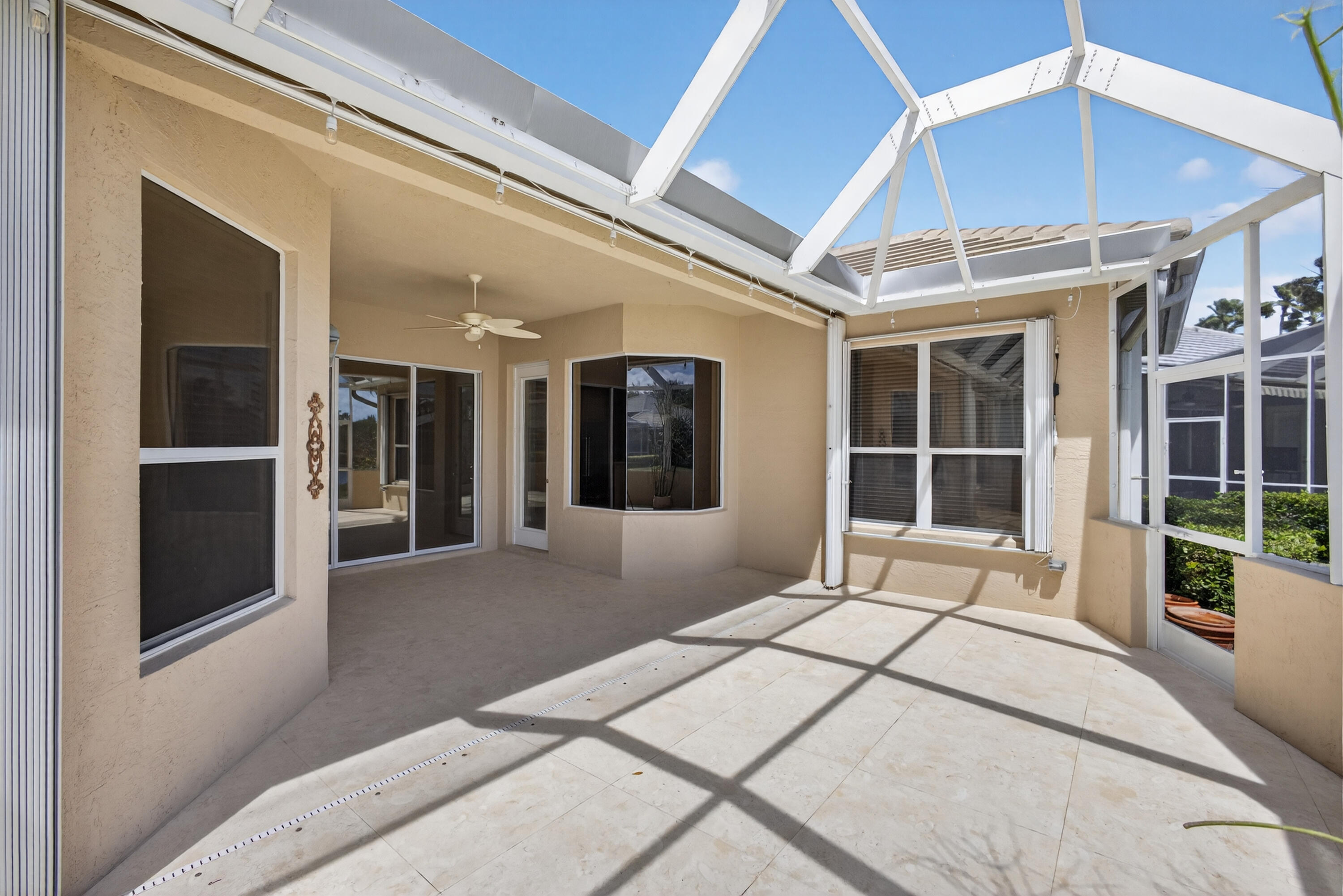 2199 Southwest Brookhaven Way Palm City, FL 34990 - Photo 69 of 119 a view of a building with a large window and potted plants