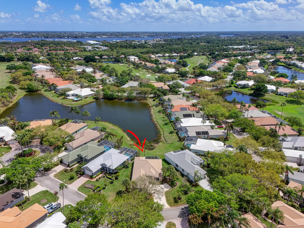 2199 Southwest Brookhaven Way Palm City, FL 34990 - Photo 82 of 119 an aerial view of city and lake with trees all around