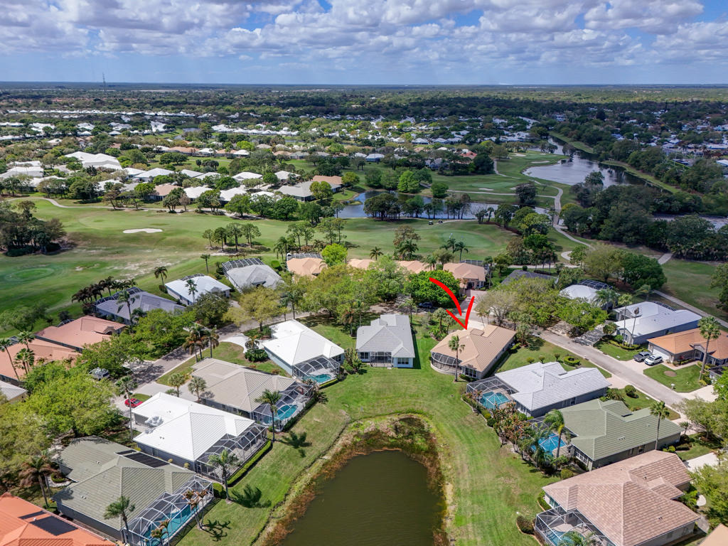 2199 Southwest Brookhaven Way Palm City, FL 34990 - Photo 85 of 119 an aerial view of a houses with a lake view