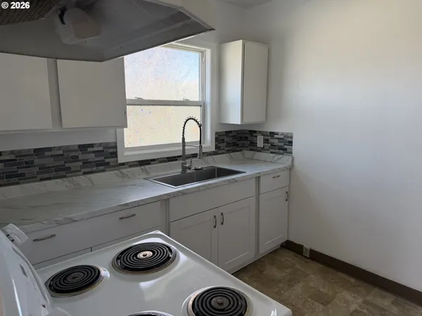 a view of storage and utility room with washer and dryer