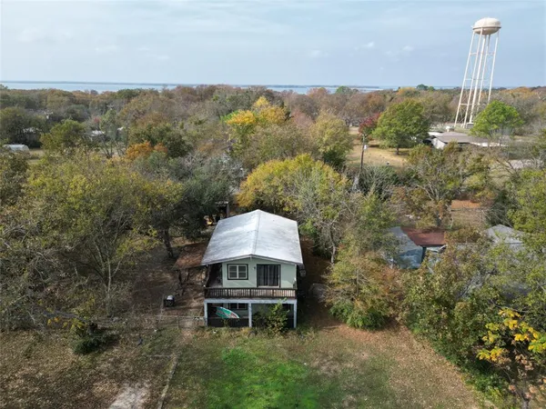 a wooden fence with some trees in the background