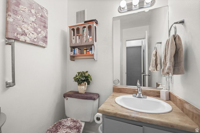 1120 Canyon Road, Unit 38 Ogden, UT 84404 - Photo 13 of 24 Half bath with toilet and vanity