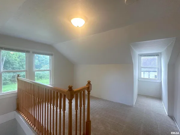 a view of a hallway with windows