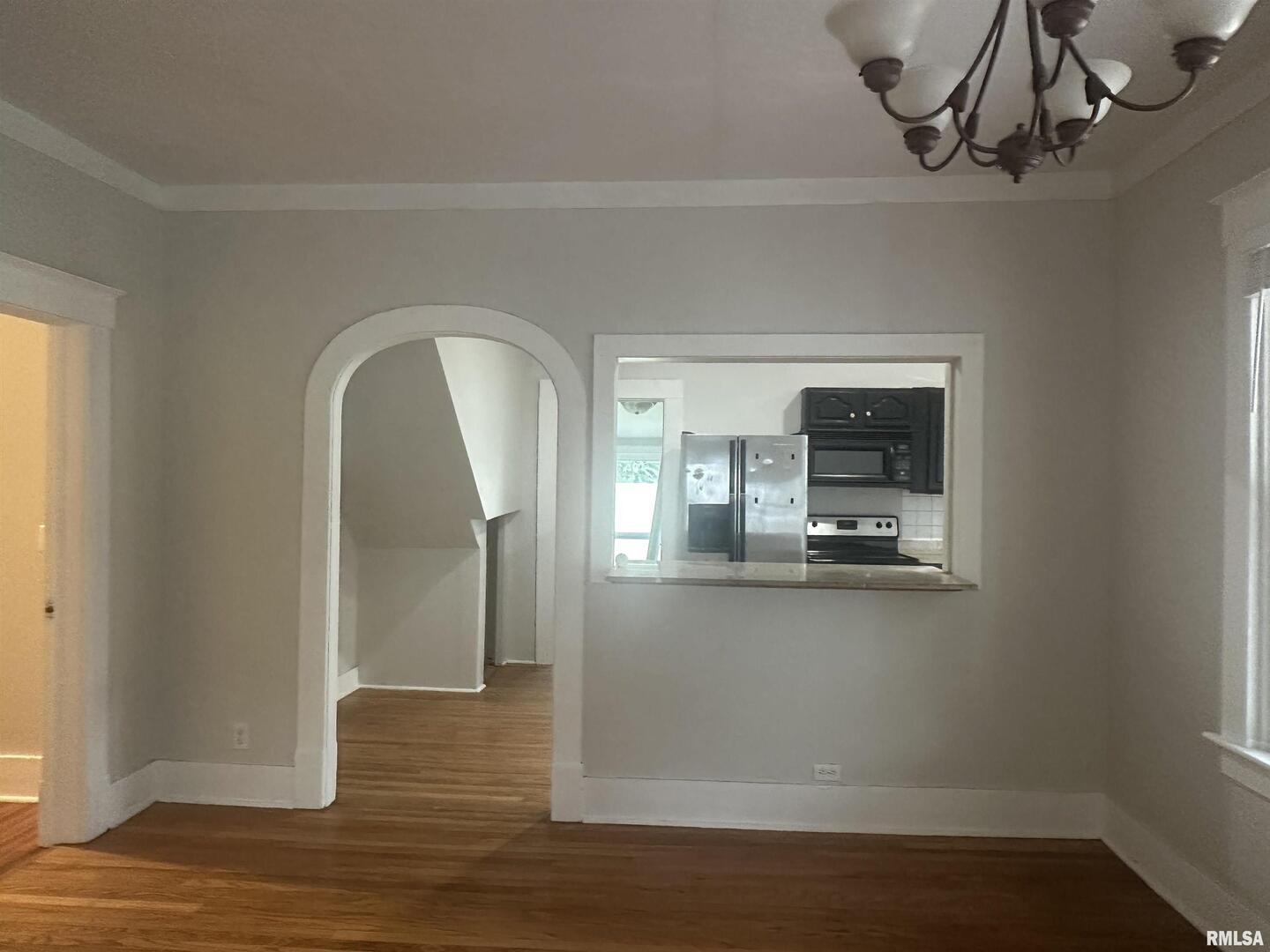 604 West Walnut Street Carbondale, IL 62901 - Photo 7 of 18 a view of a room with wooden floor and staircase