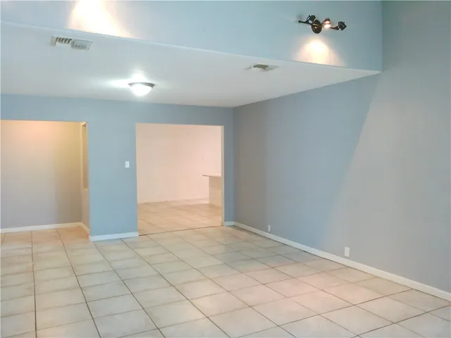 a view of an empty room and window