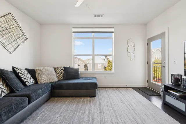 a living room with furniture and a window