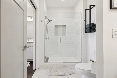 a bathroom with a shower and a toilet
