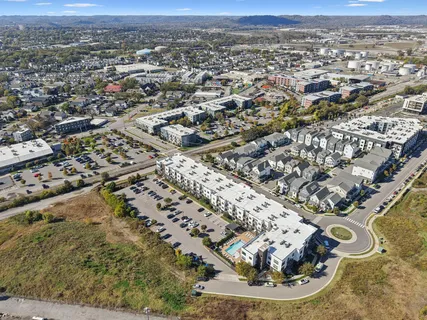 an aerial view of a residential houses with outdoor space