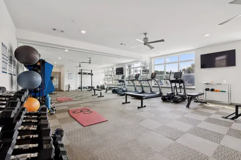 a living room with furniture and a rug