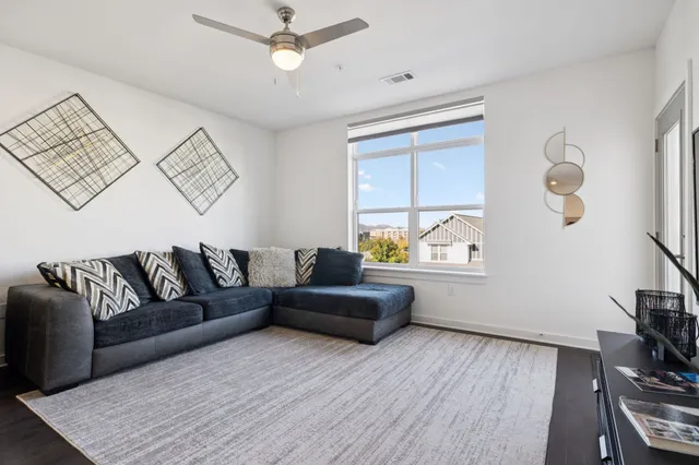 a living room with furniture and a window