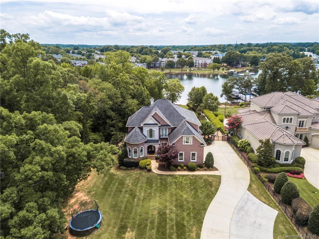 18424 Nantz Road Cornelius, NC 28031 - Photo 2 of 47 a view of a lake with a house in the background
