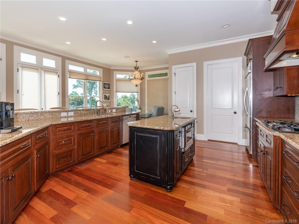 18424 Nantz Road Cornelius, NC 28031 - Photo 19 of 47 a kitchen with stainless steel appliances granite countertop a stove a sink dishwasher a refrigerator and a oven