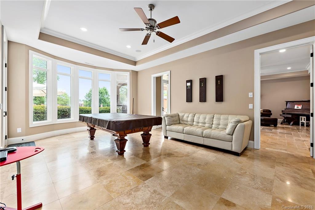 18424 Nantz Road Cornelius, NC 28031 - Photo 37 of 47 a living room with furniture and a large window