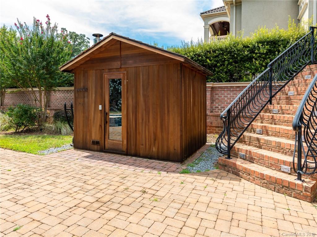 18424 Nantz Road Cornelius, NC 28031 - Photo 43 of 47 a view of a house with backyard and trees