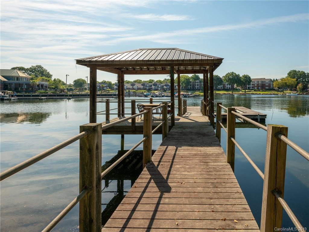 18424 Nantz Road Cornelius, NC 28031 - Photo 46 of 47 a view of a swimming pool with seating area and hardwood floor