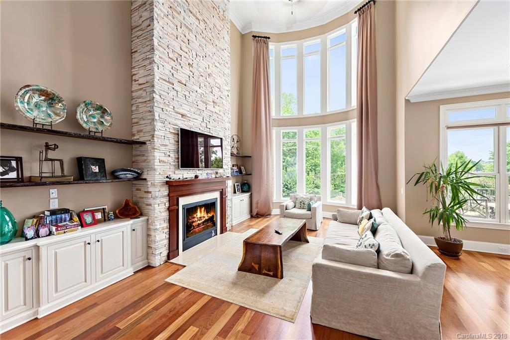 18424 Nantz Road Cornelius, NC 28031 - Photo 7 of 47 a living room with furniture fireplace and flat screen tv