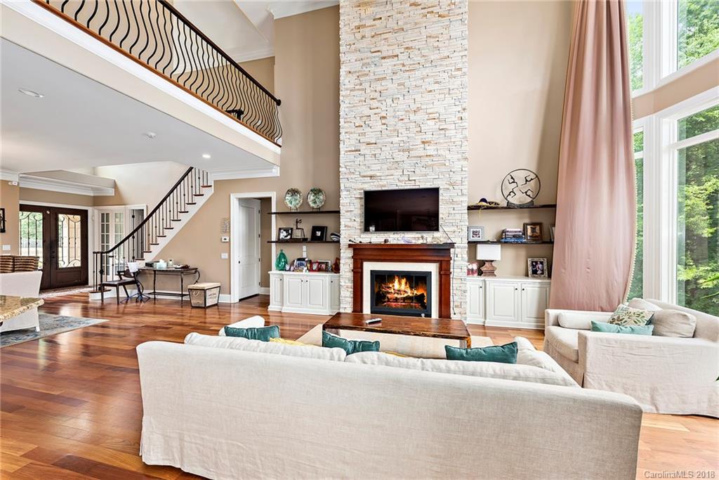 18424 Nantz Road Cornelius, NC 28031 - Photo 8 of 47 a living room with furniture and a fireplace