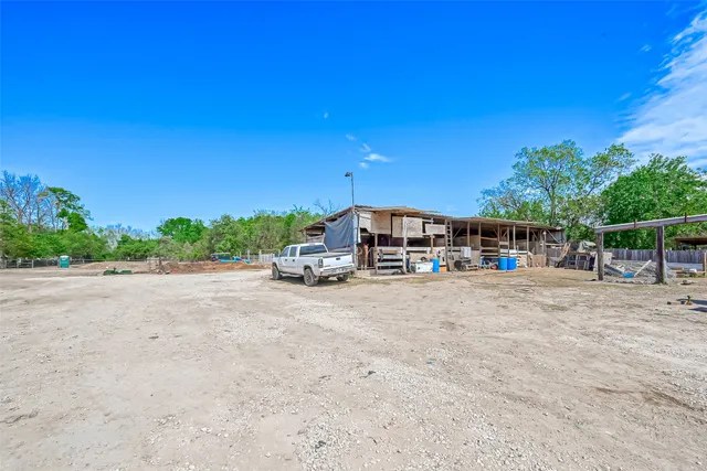 an aerial view of a house with a swimming pool