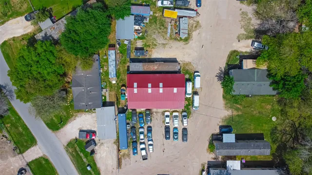 an aerial view of a house with garden space and street view