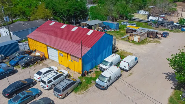an aerial view of a house with garden space and street view