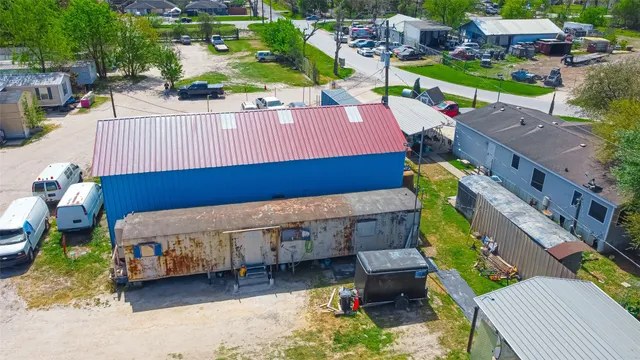 an aerial view of a house with outdoor space