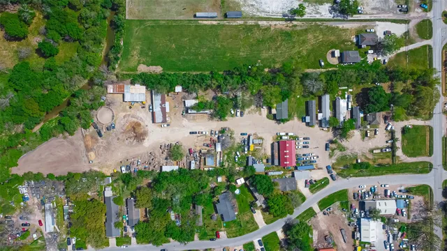 an aerial view of a house with outdoor space
