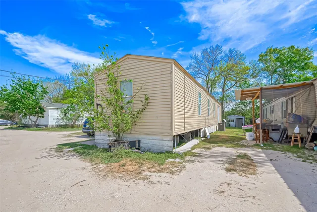 a view of a backyard with a small cabin