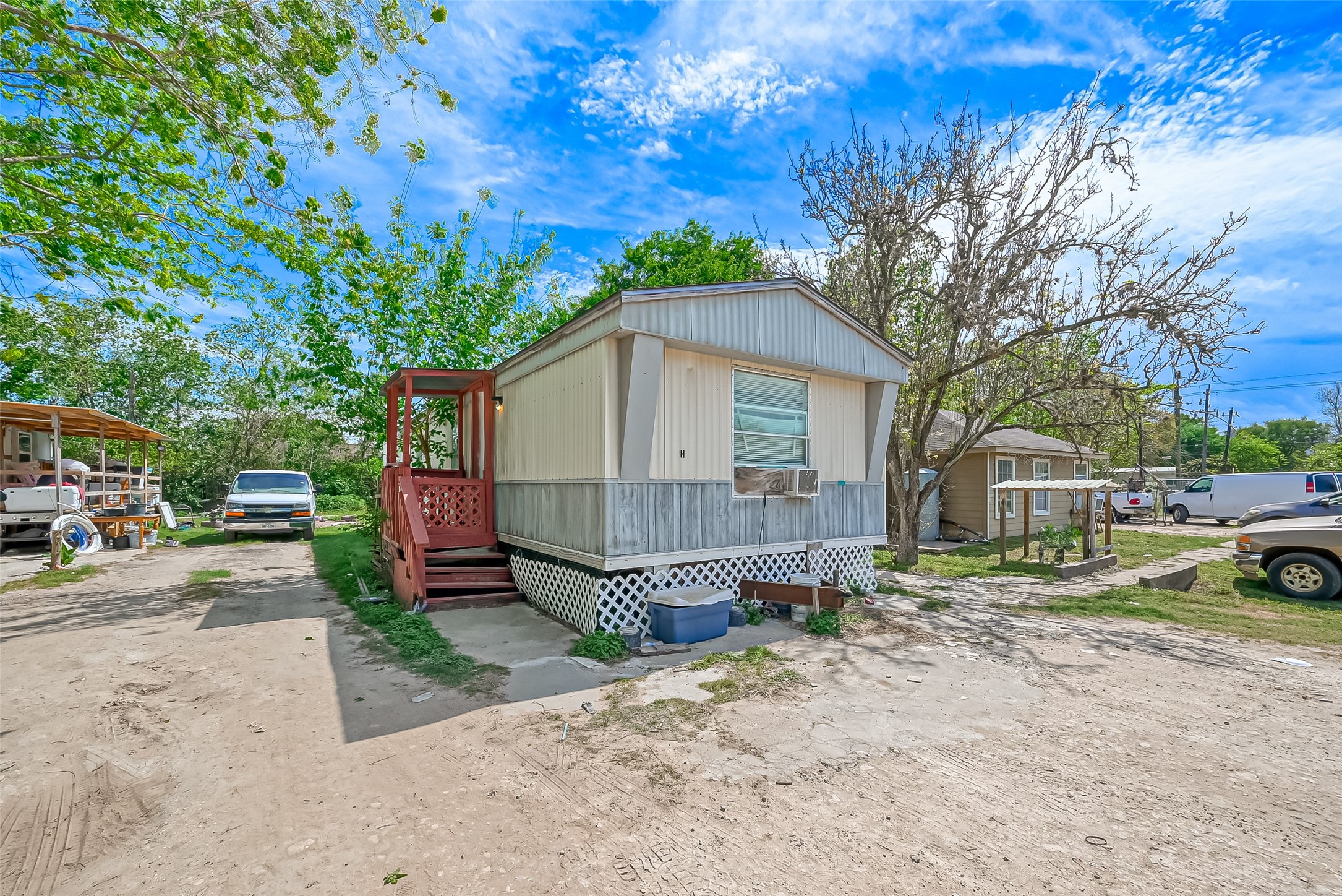 511 Gulf Bank Road, Unit 5 Houston, TX 77037 - Photo 9 of 31 a front view of a house with a yard and garage