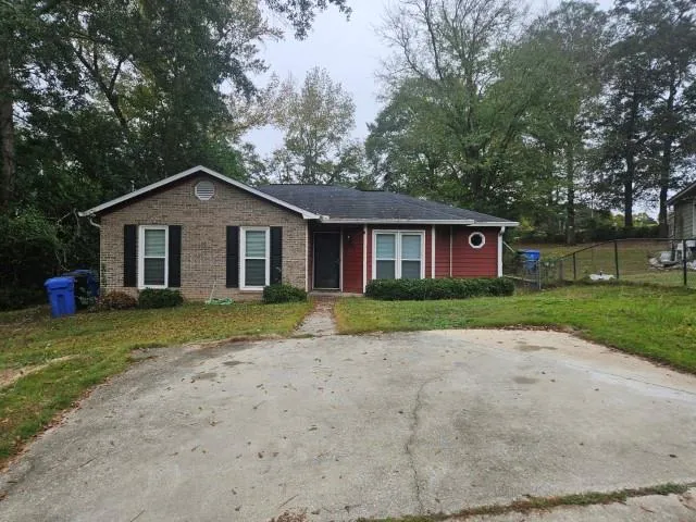 a view of a yard in front of a house with a big yard