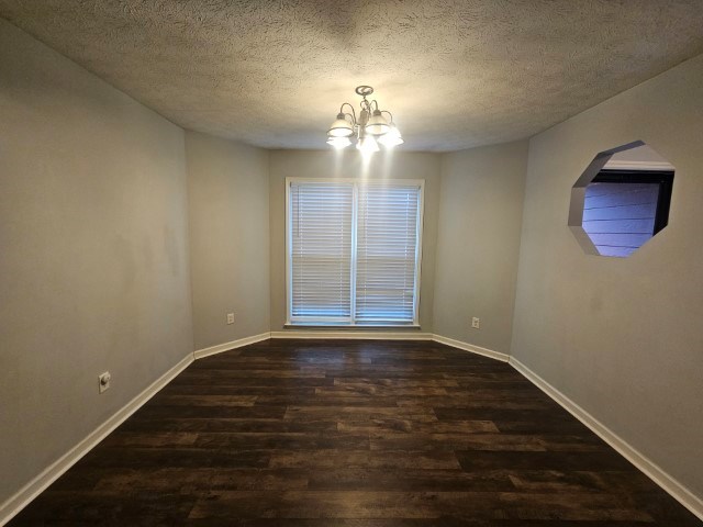 1804 Dallas Court Columbus, GA 31907 - Photo 12 of 50 a view of an empty room with wooden floor and a window